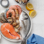 Seafood Platter Delight: Shrimps, Salmon, Oysters Galore. Flat lay with copy space